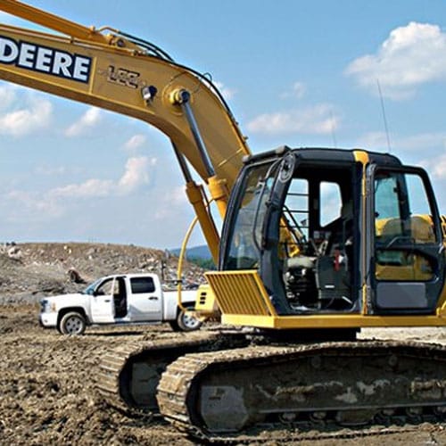 A backhoe with rhino lined sides and door